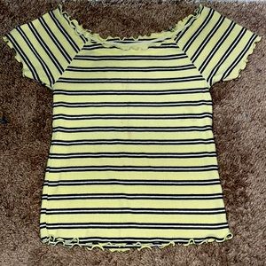 Yellow and black striped shirt with ruffles at the end